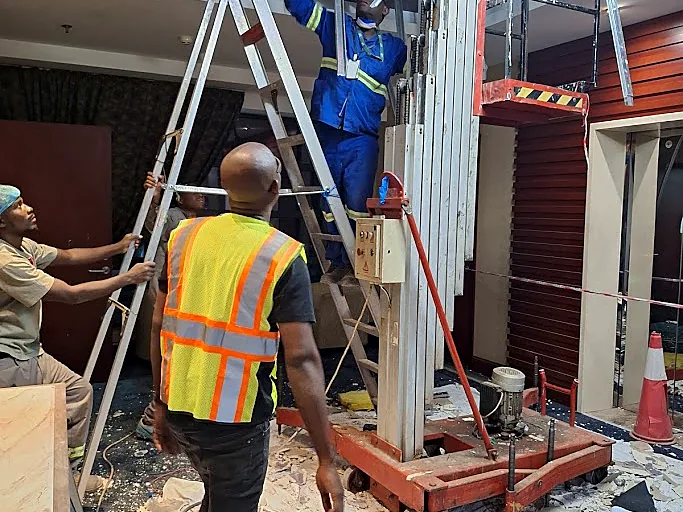 Technicians carrying out indoor HVAC installation work